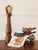 This amazing pepper grinder is nearly 20" tall! Made of light and dark wood, it's been expertly turned and well taken care...