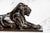 A striking example of early 20th-century decorative metalwork, this circa 1915 cast metal statue depicts a reclining lion,...