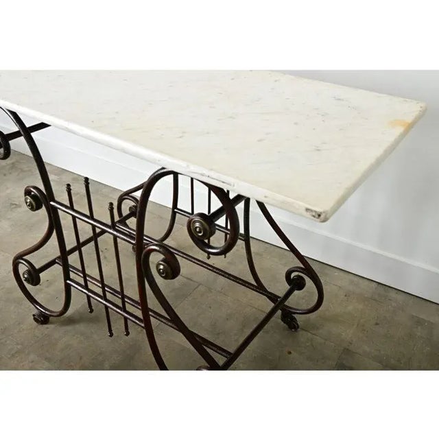 A fanciful French marble and iron work table from circa 1860, that would have been a display fixture in a butcher shop or...