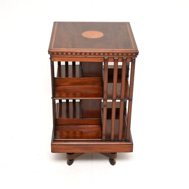 An outstanding antique Edwardian inlaid revolving bookcase. This was made in England, it dates from around the 1890-1910...