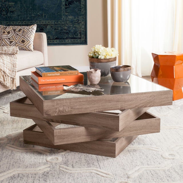The designs of one of Japan’s award-winning architects inspired this light grey contemporary coffee table. a expert...
