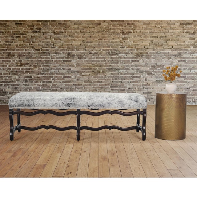 A beautifully crafted Italian "Os de Mouton" bench crafted from beechwood with hair on hide leather upholstery designed by...
