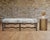 A beautifully crafted Italian "Os de Mouton" bench crafted from beechwood with hair on hide leather upholstery designed by...