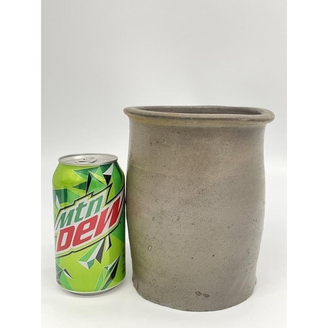 An antique handmade stoneware crock with rich organic texture and timeless primitive character. This hand-thrown pottery...