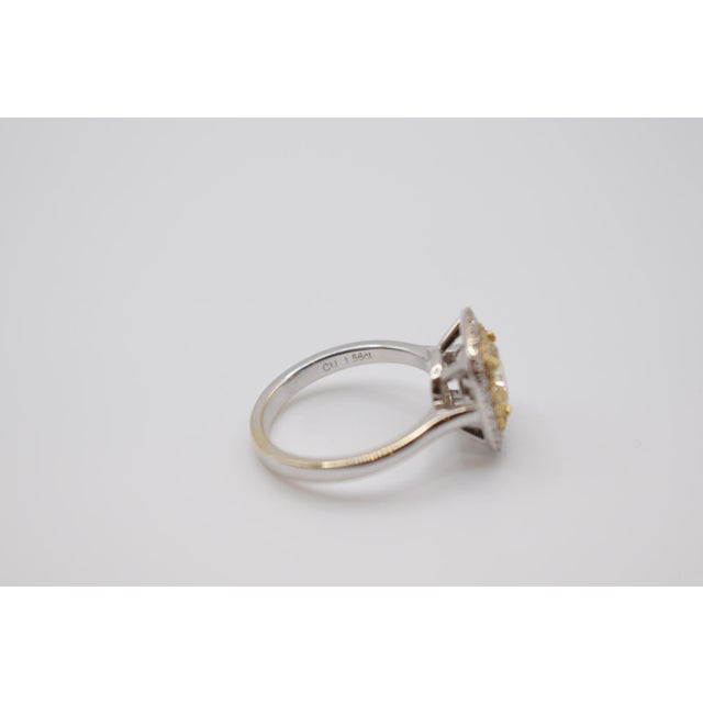 This is a beautiful EFFY brand 18k white gold Halo diamond ring. It features a yellow cushion modifies brilliant cut...