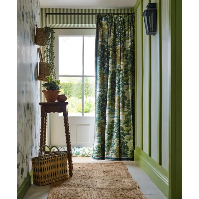 This impressionist scene of ancient trees and arched bowing branches creates a dense canopy that draws the eye towards a...