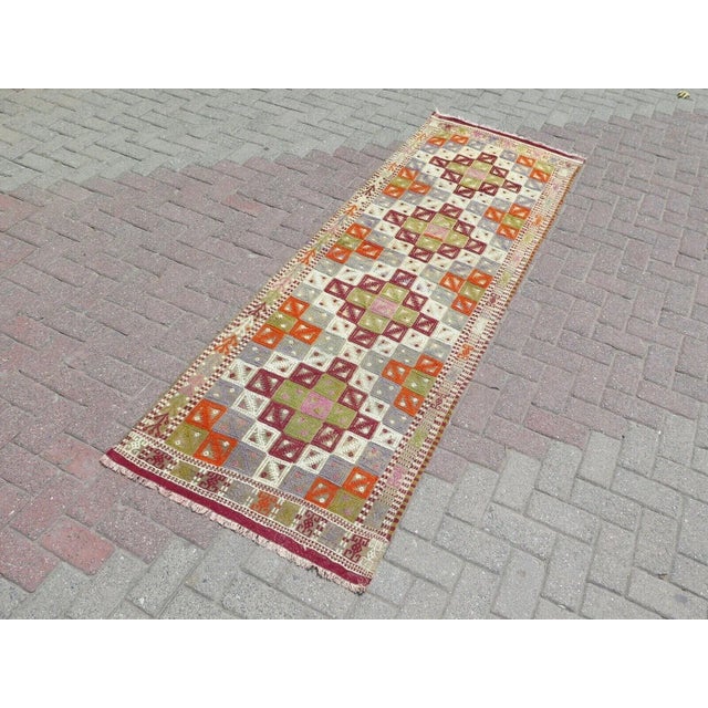 This beautiful, traditional vintage, hand knotted Turkish runner is approximately 60 years old. It is handmade of very...