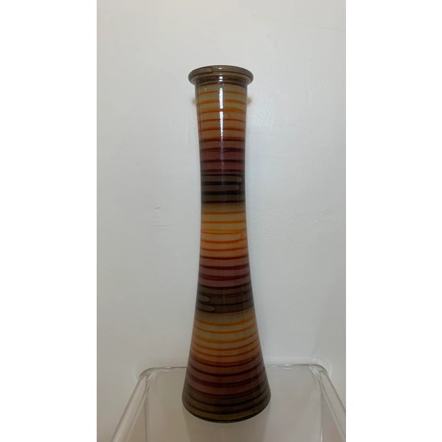 Vintage mid century Spanish multicolored striped tall vase. Very thick glass, with stripes of brown, orange and green’s.