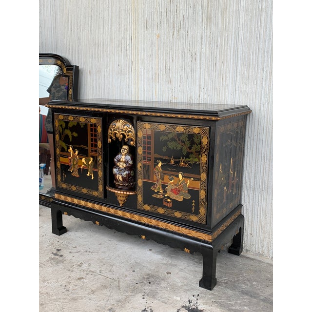 About This incomparable chinoiserie black lacquer sideboard depicts figures in various typical traditional scenes. What...