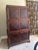 A rare and sophisticated entertainment cabinet by Bernhardt, masterfully crafted from rich mahogany and accented with...