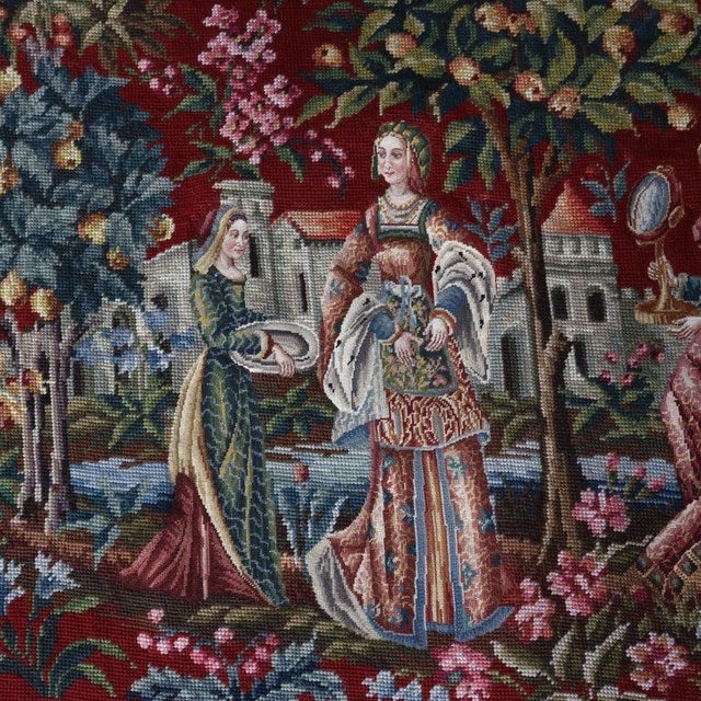 An antique needlepoint tapestry, dating to the 19th century, presents a captivating Louis XIII style scenic pictorial....