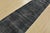 An authentic vintage overdyed Tabriz runner hand-knotted with fine wool on a cotton foundation. This rug features a solid...