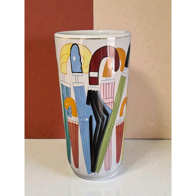 Add a touch of vintage charm to your home with this whimsical painted colorful ceramic umbrella stand. Standing at 18...