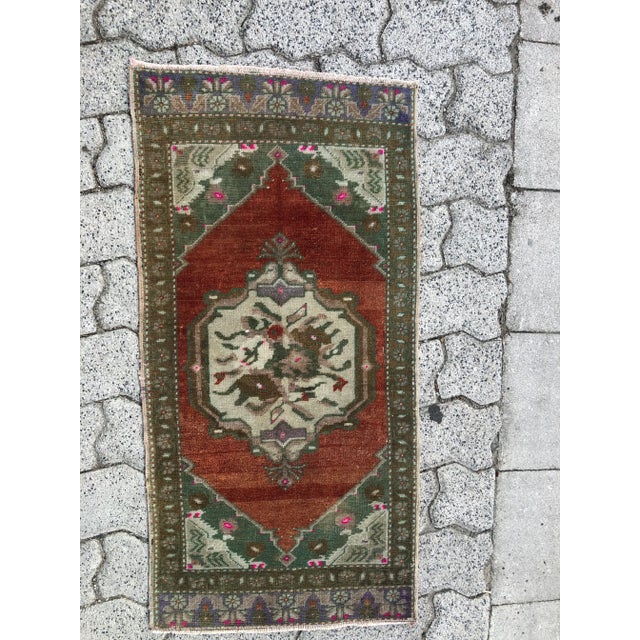 This is a vintage Turkish Oushak rug from the 1960s. The piece was hand-knotted.