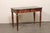 An elegant Italian wooden console table, with marble top, from the early 19th century. This antique table from Italy...