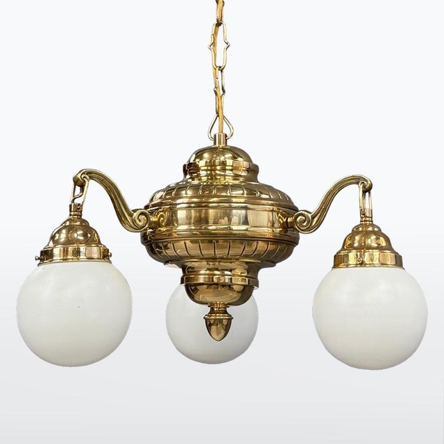 Art-Deco, Date of manufacturer: 1900 – 1910 material: brass, white opal glass. The chandelier is cleaned and polished. New...