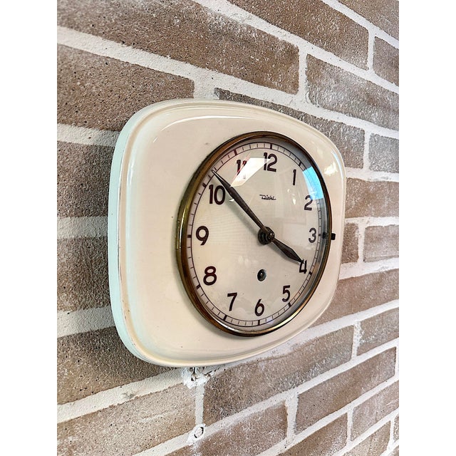 Elegant vintage wall clock by diehl (made in germany), featuring a square case with rounded corners, crafted from ivory-...