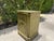 Vintage hand-painted Florentine style commode cabinet featuring an antiqued green finish with decorative floral and...