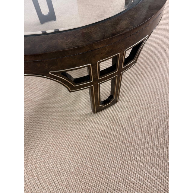 Likely the only example in existence today. This gorgeous Mastercraft Burled Coffee table with inset brass trim is in...
