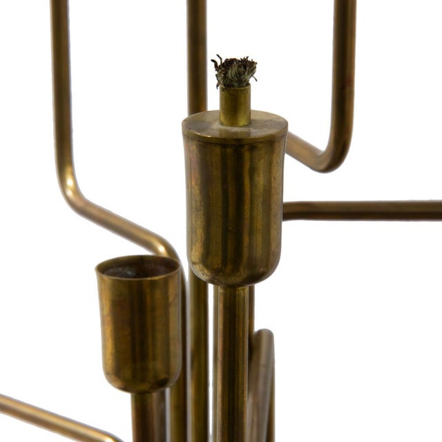 Thalita is a seven-arm brass floor lamp made in Italy, designed as a sculptural element for spacious rooms. The arms,...