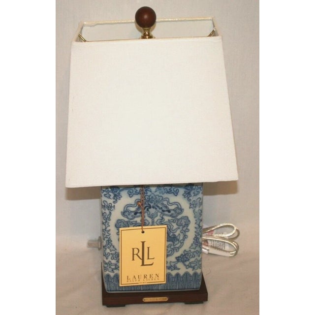 Add a touch of timeless elegance to your home with this Lauren Ralph Lauren porcelain table lamp, featuring a delicate...