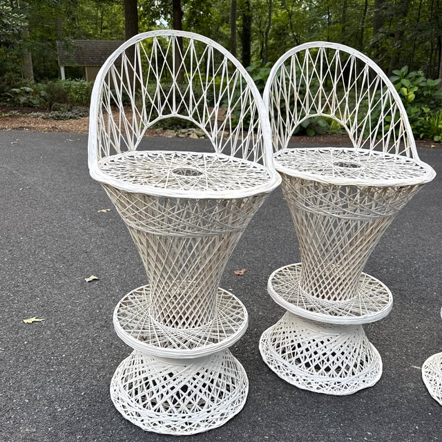 A set of Russell Woodard attributed spun fiberglas barstools. This iconic vintage style is extremely desirable. The stools...
