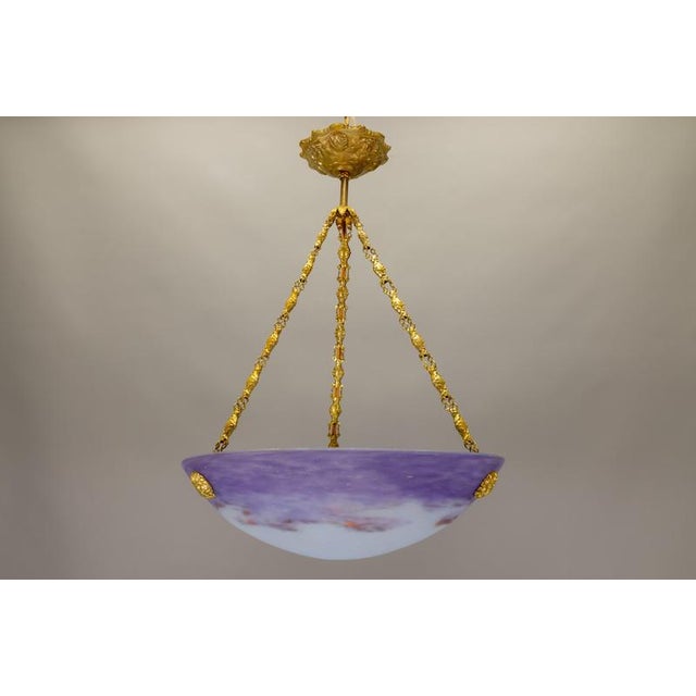 Elegant french art nouveau pendant light from the 1920s, featuring a finely hand-blown glass bowl by muller strasbourg,...