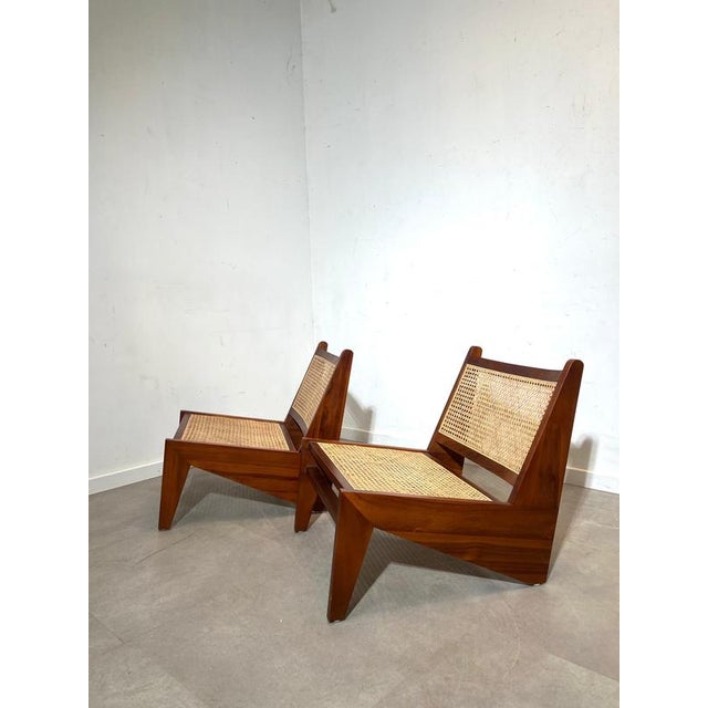 Beautiful mid-century lounge chair featuring a warm teak wooden frame combined with handwoven cane seating and backrest....