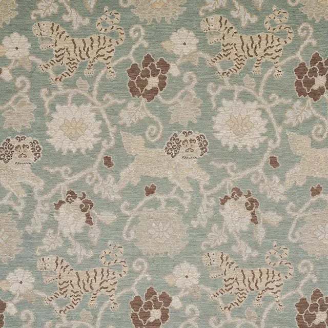 Inspired by antique Tibetan rugs, the luxuriously thick cloth is covered in an enchanting pattern of tigers, snow lions,...