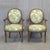A stunning pair of vintage 1990s French Louis XVI style carved wood armchairs (fauteuils) featuring round medallion backs,...