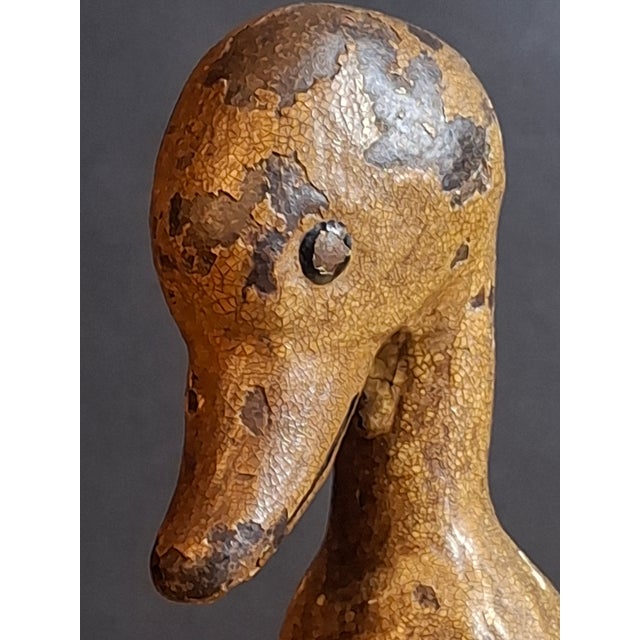 Early 20th-century American cast iron standing duck paperweight, measuring approximately 4.5 inches tall and weighing 1 lb...