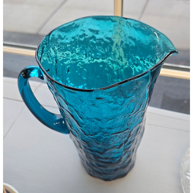 Vintage vibrant Peacock Blue pitcher. Crackle glass just adds to the beauty with all that texture.Makes a fabulous vase as...