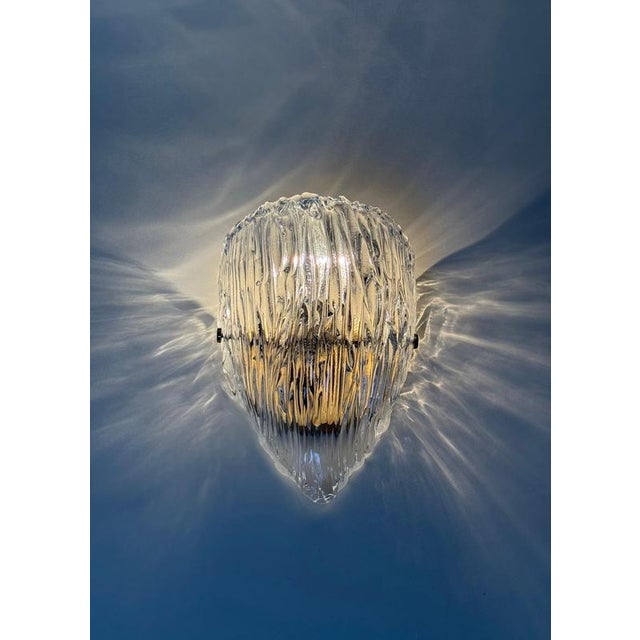 An exceptional pair of italian murano glass and bronze wall sconces, attributed to the renowned lighting manufacturer...