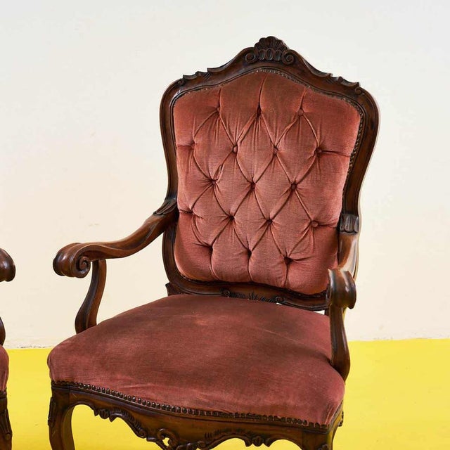 These expertly crafted vintage armchairs embody the timeless elegance of classic design. Featuring a carved wooden frame...