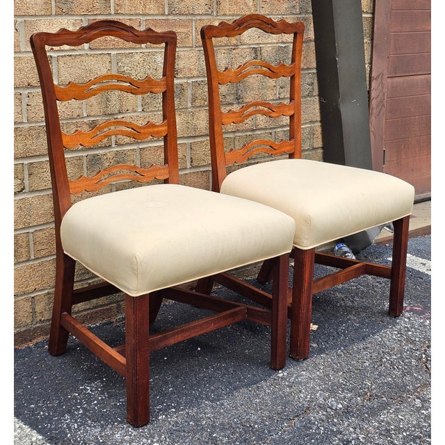 A Pair of Chippendale Style Mahogany and Pierced Ladder back and Upholstered seat Side Chairs Measures 22" in width x 21"...