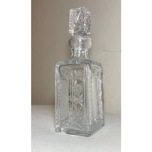 Up for sale is a high quality vintage American brilliant cut clear crystal decanter. It's done with very ornate wheel cut...