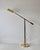 Vintage brass articulated pharmacy floor lamp, in the style of Casella Lighting. The classic shade is fully adjustable and...