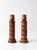 Charming pair of vintage turned wood candlestick holders featuring eight removable center rings that can be stacked along...