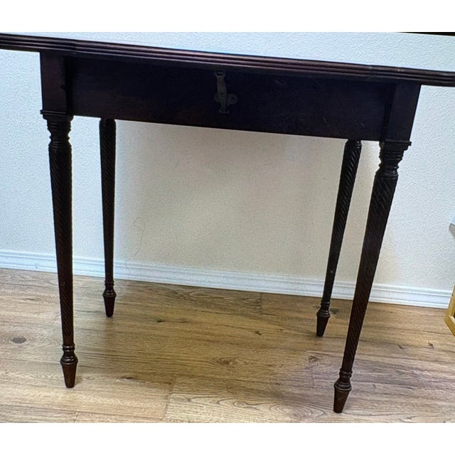 This nice vintage mahogany Pembroke dropleaf table with rope-carved or spiral-turned legs is very nice still to this day....