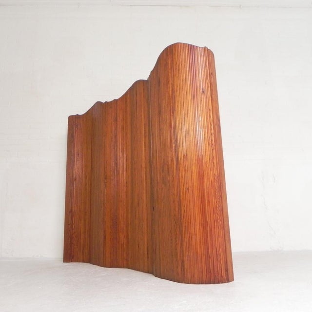 These room dividers were formerly used in cafes and shops to separate spaces. The room divider features pine slats held...