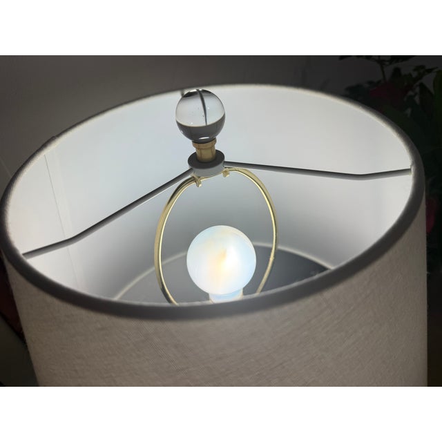 Authentic AERIN Morton Table Lamp in the Burnished Silver Leaf finish with original linen shade. End table, artwork, and...