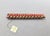 1960s goldtone curled edges with a line of faux-coral beads down the center bar brooch with security clasp. Marked...