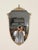 Wonderful and unique Mid-Century wall mirror in solid brass with an elegant shield-shaped silhouette. This refined mirror...