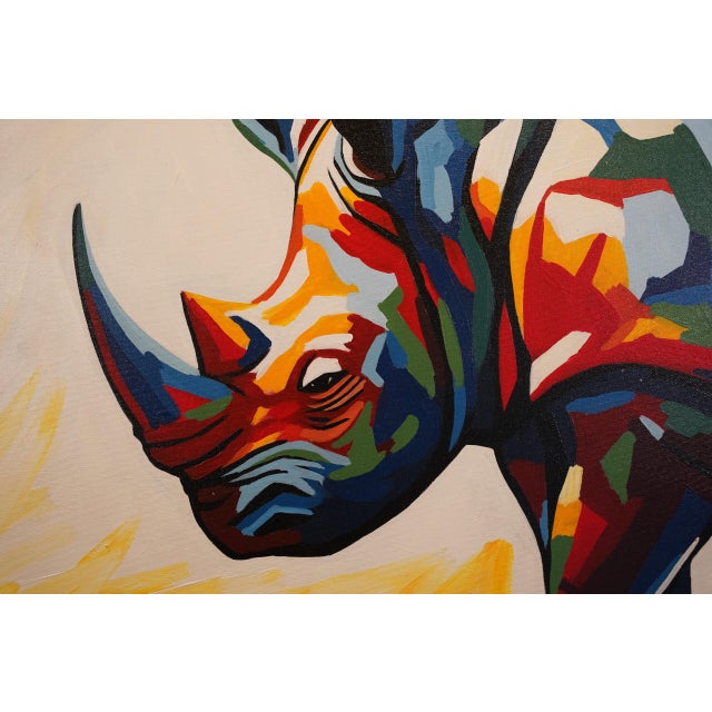 A rhinoceros in profile built from bold, faceted color - calm, grounded and full of presence. Original one-of-a-kind...