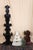 A corner shelf with 2 shelves with scroll cut or fretwork edges and handcarved flowers and gothic shapes. Folk or rustic...