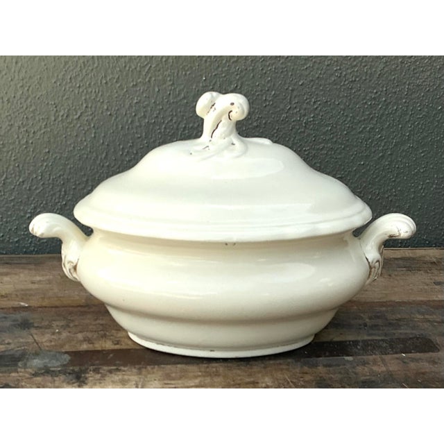 Bring a sense of rustic elegance to your table with this vintage glazed ceramic tureen. Featuring a classic oval...
