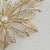 Vintage 1980s Napier gold-tone maple leaf brooch. This elegant statement pin features an intricate open-work leaf design...