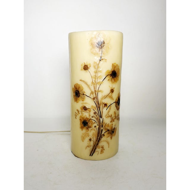 Decorative wax lamp with dried flowers, France, 1970s, with a delicate and poetic charm. This cylindrical lamp is made of...