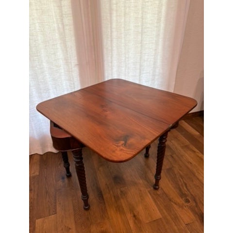 Mahogany Sheraton-style lift-top console / hallway table with barley twist legs Top lifts and turns 90 degrees to expand...