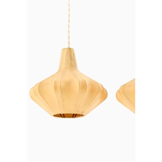 This rare ceiling lamp, likely produced in sweden during the 1950s, showcases the clean lines and organic forms typical of...